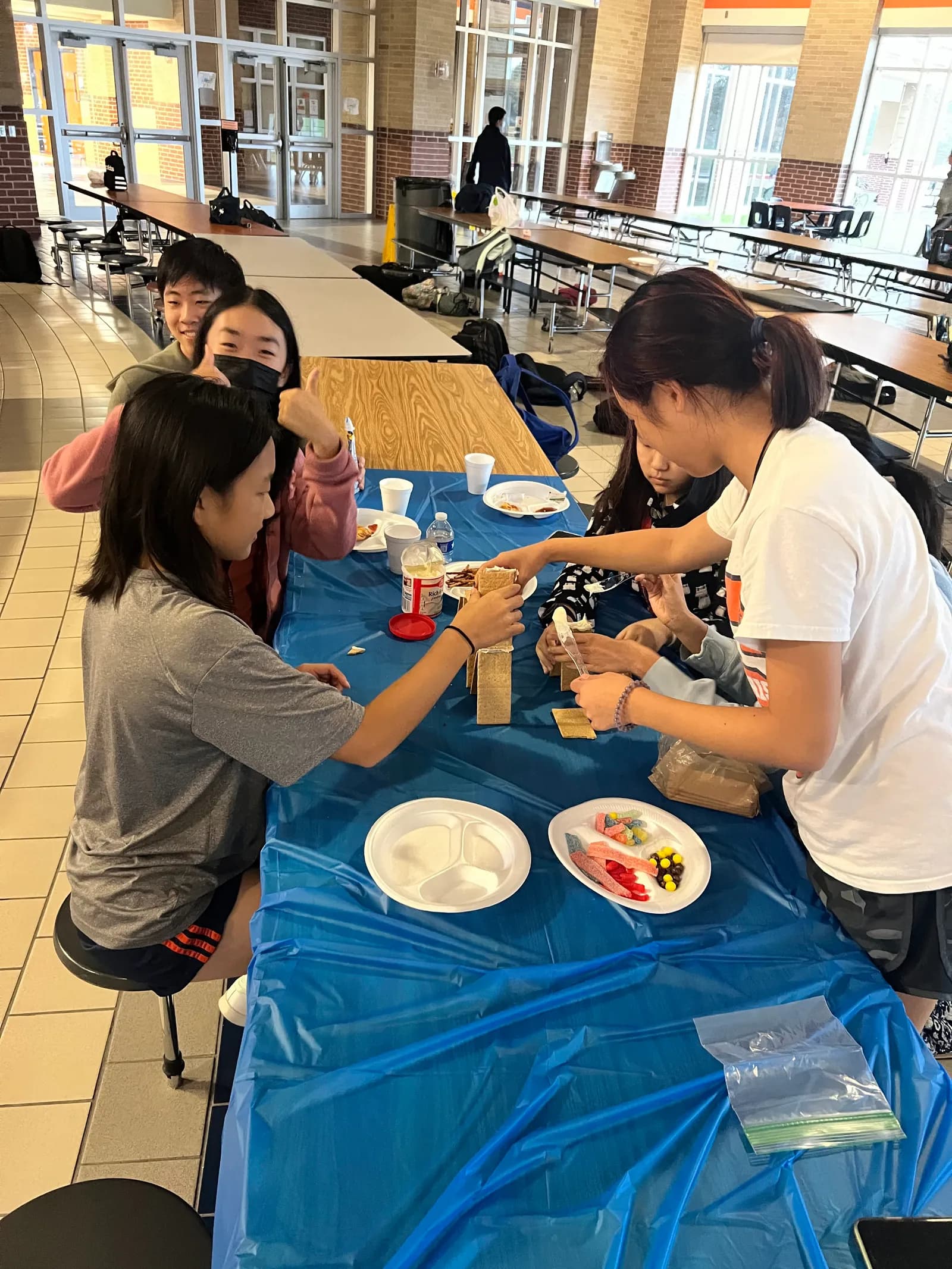 Members working on builds together at the table